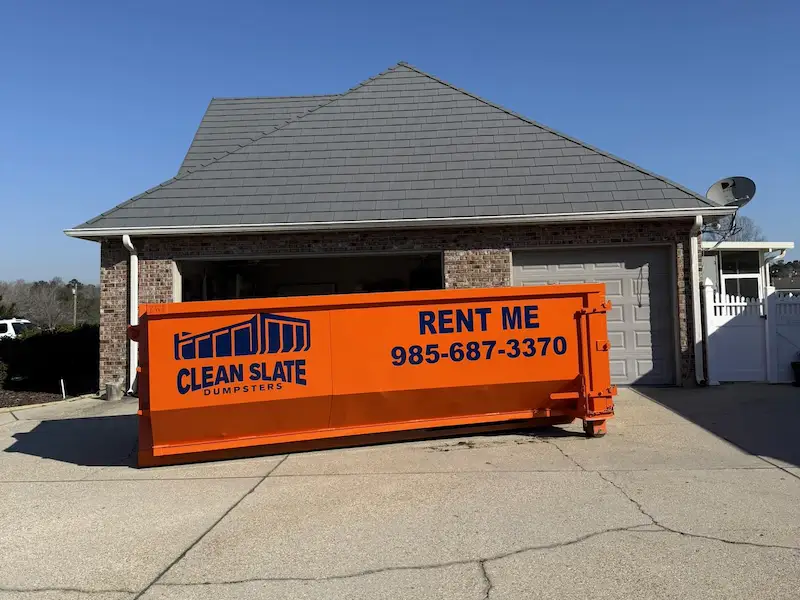 clean slate dumpster in front of house