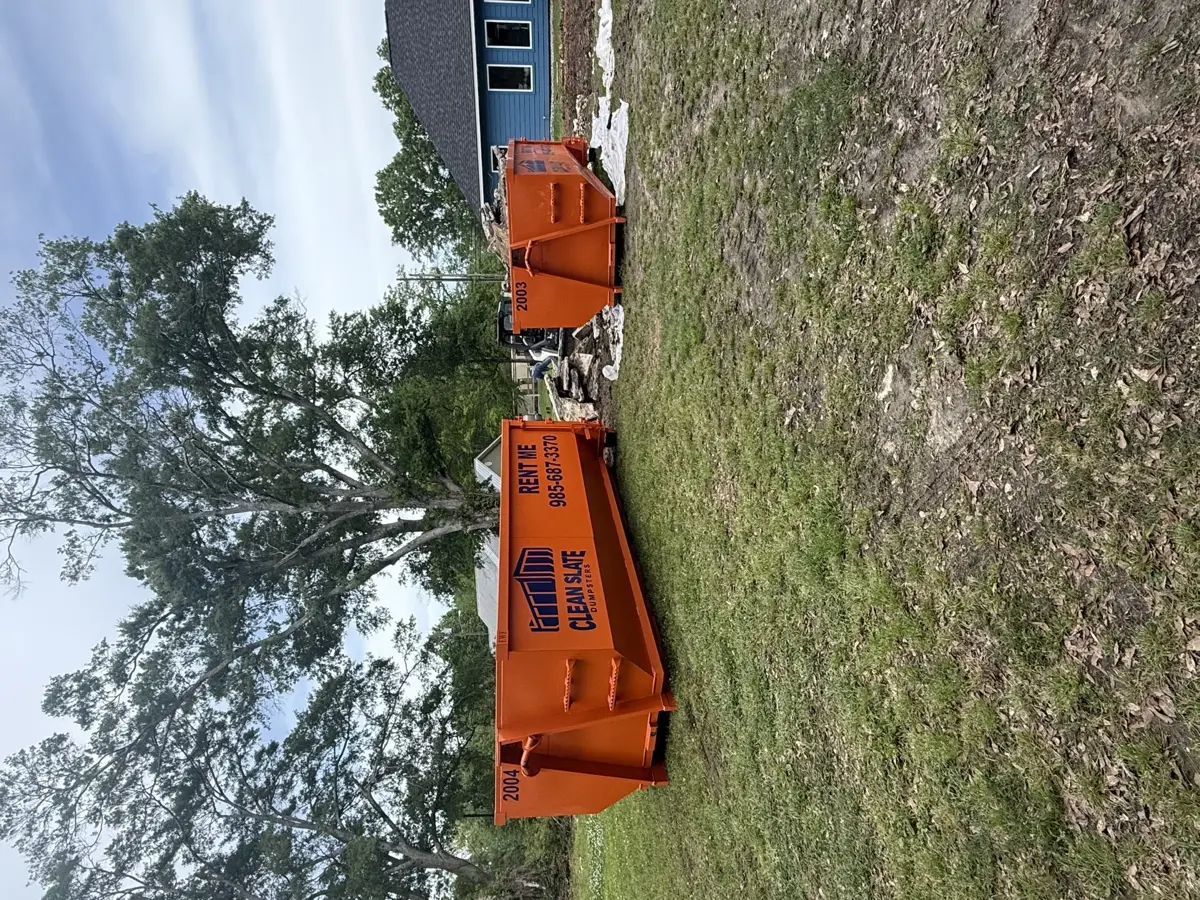 dual dumpster stacked wood debris site