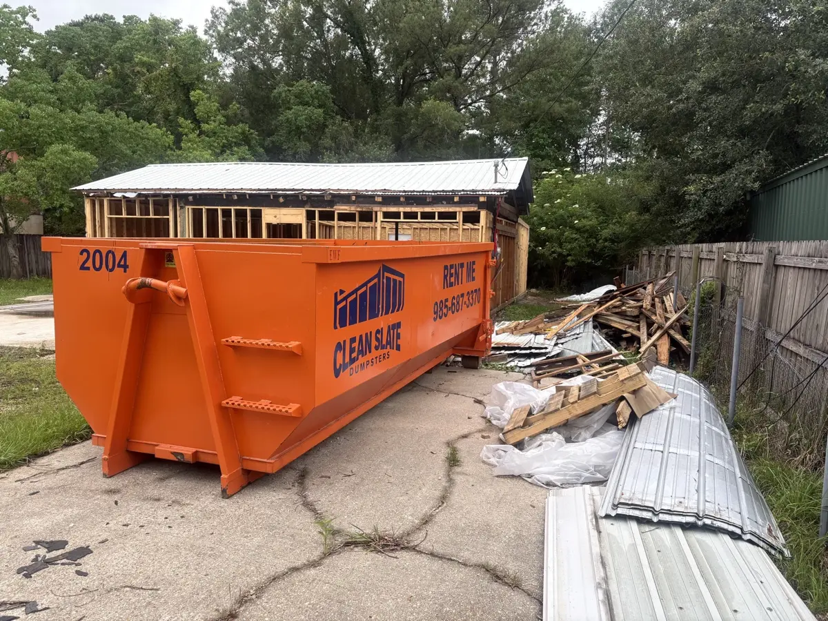 dumpster demolition debris roof framing