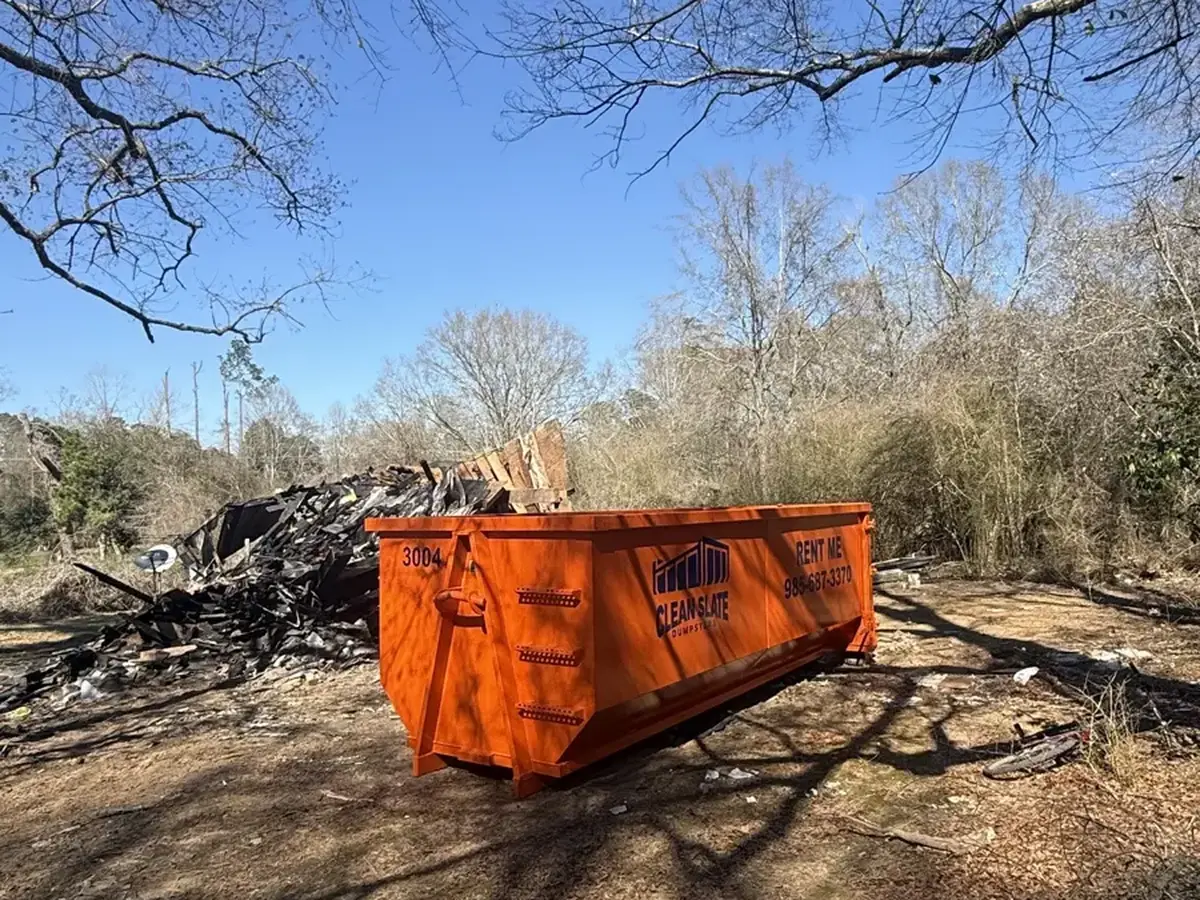 dumpster gravel road rural woods site