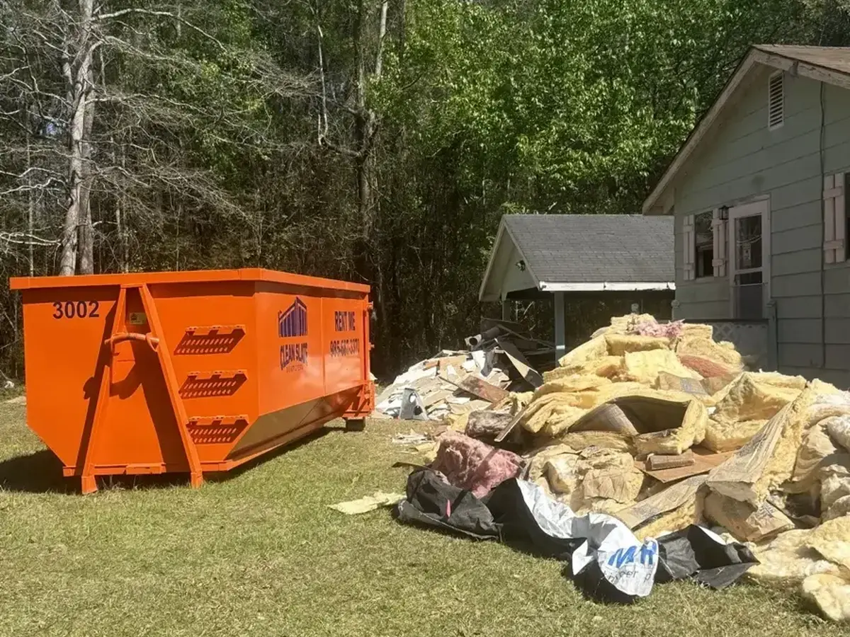 dumpster house shingles roof demo