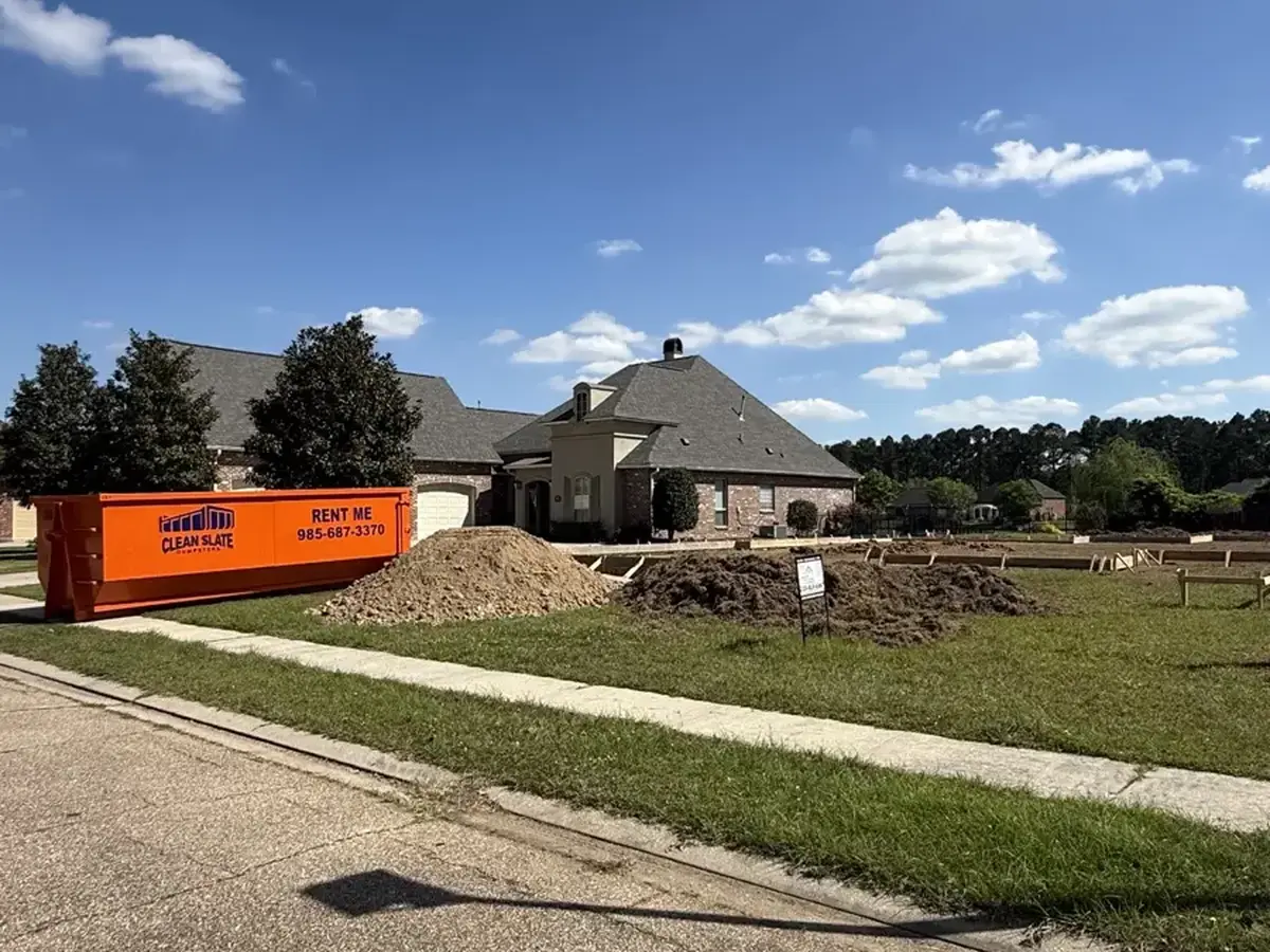dumpster residential driveway flat angle