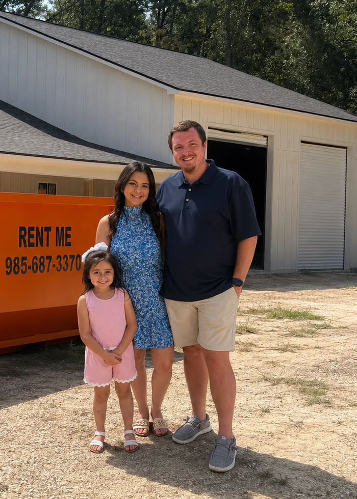 Chris Martin, founder of Clean Slate Dumpsters, with his family beside a company roll-off dumpster in Hammond, LA