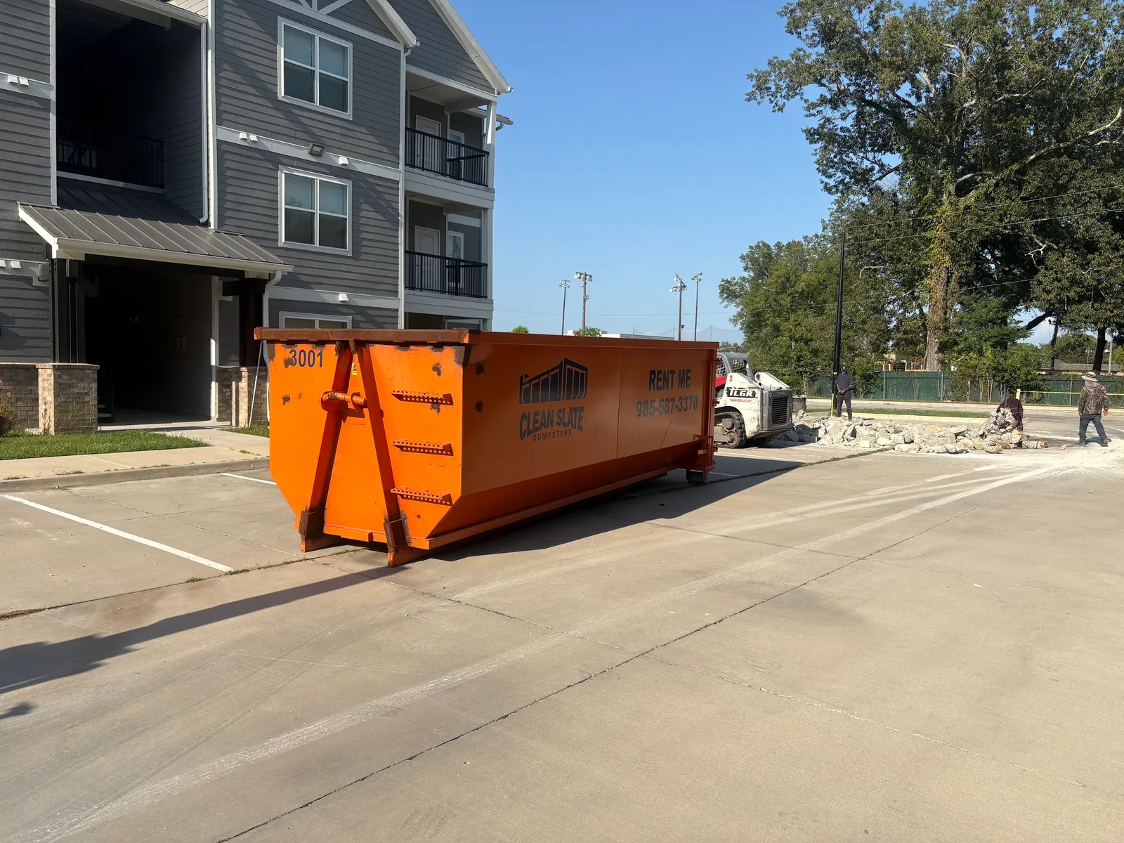Clean Slate 30-yard roll-off dumpster at an apartment complex renovation in Hammond, LA